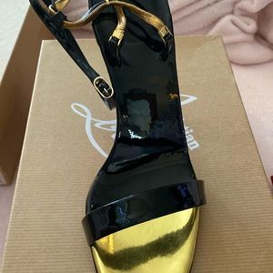 Never worn Black patent and gold Christian Louboutin high heel anklet